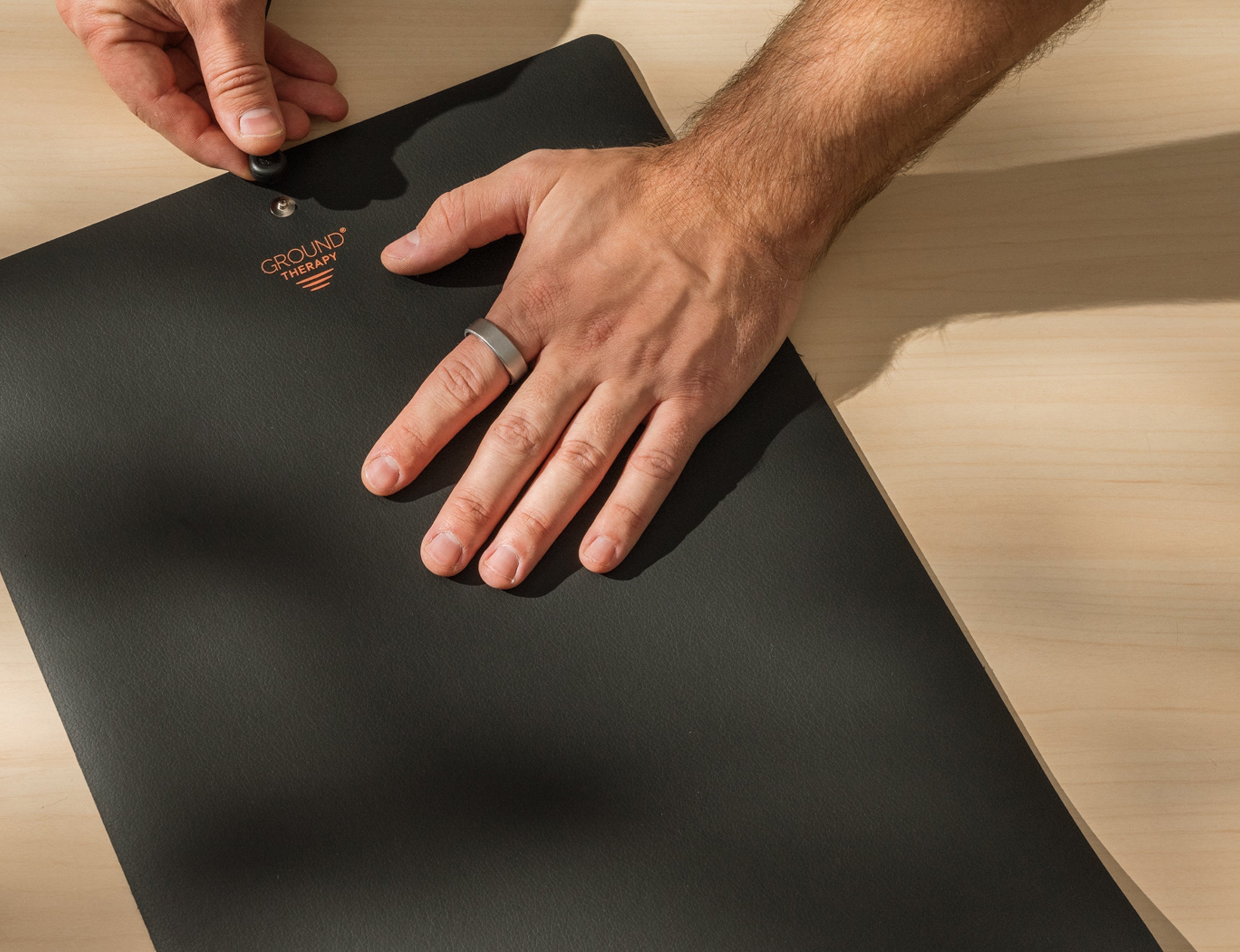 Earthing Canada Grounding Universal Mat being plugged in